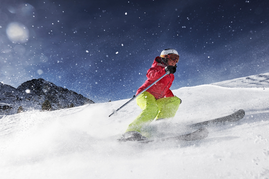 A skier navigates a snowy slope at the X Games, capturing the thrill of competition in winter sports.