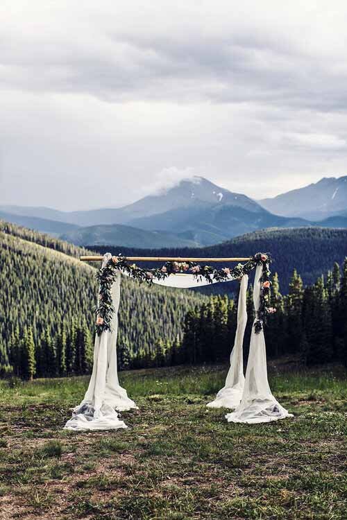 A beautiful wedding ceremony at a mountain lodge in Aspen, showcasing the couple's love amidst nature.