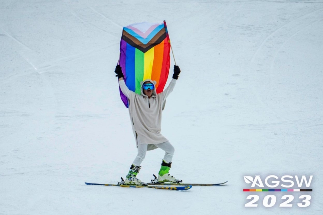 The skier is showing the flag of the LGBT community