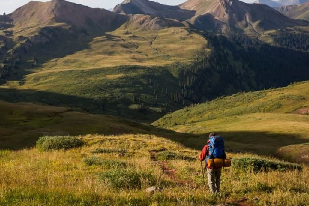 A hiker is exploring West Maroon Pass in Aspen