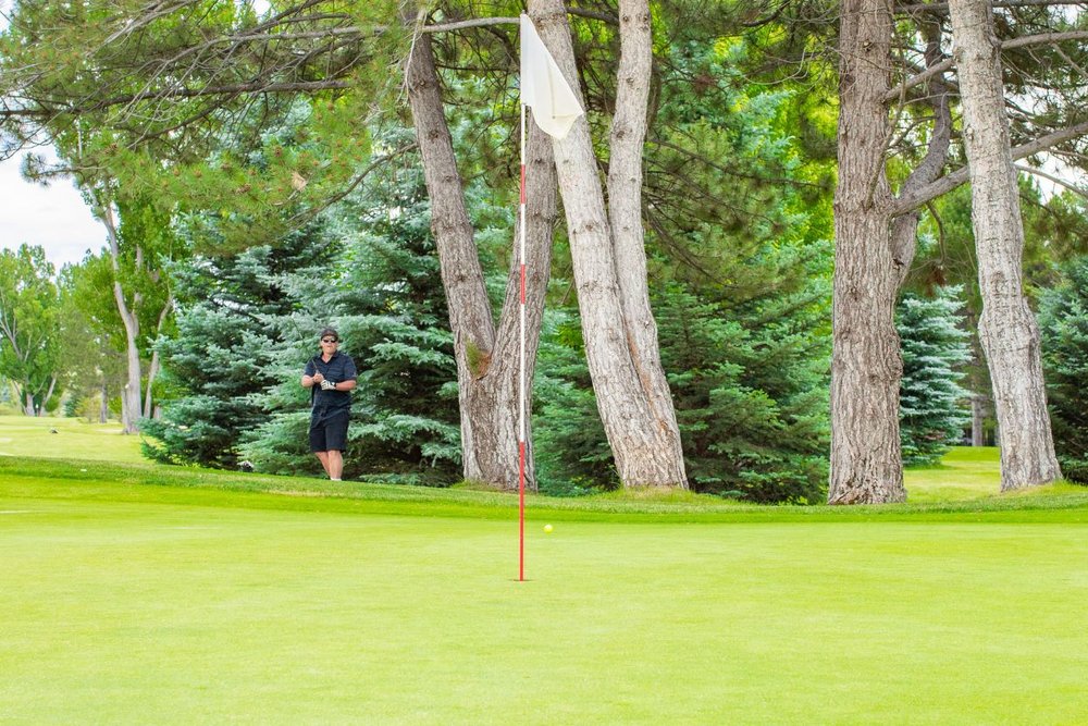 A professional plays golf at the River valley ranch Golf Club