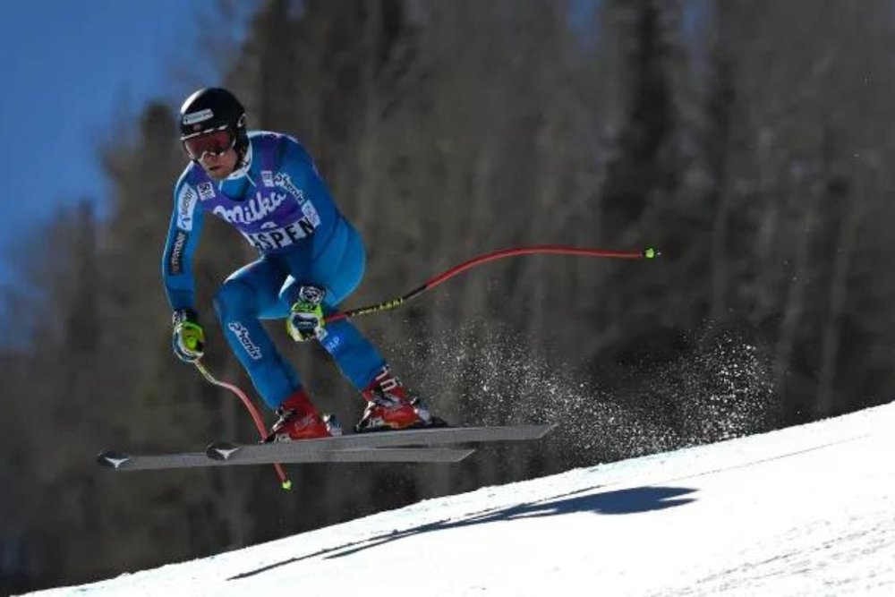 The skier is performing at the Ski World Cup in Aspen