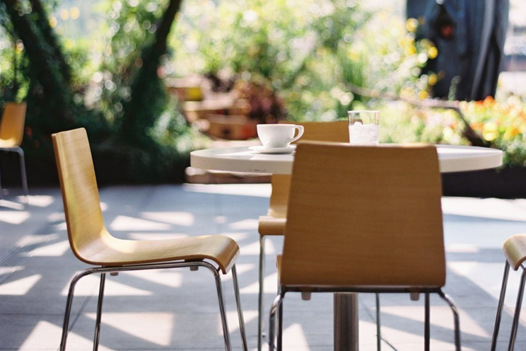 An outdoor setting featuring two chairs at a table, ideal for dining with relaxing atmosphere