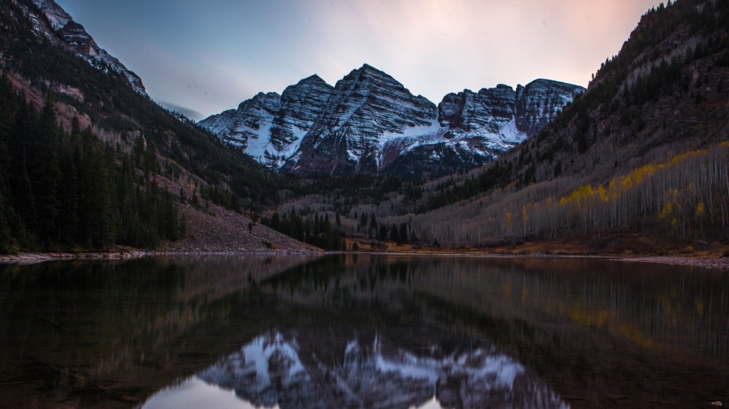 The iconic Maroon Bells, featuring stunning mountain reflections in a tranquil lake.