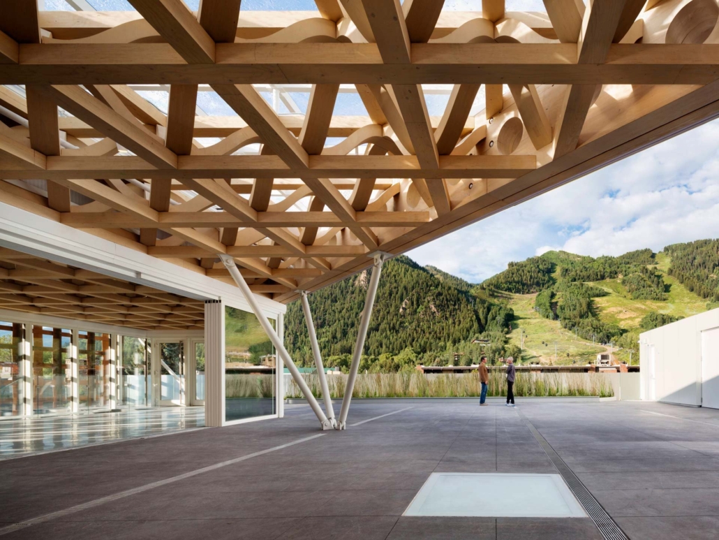 A view of a building's interior featuring rustic wooden beams that enhance its architectural charm.