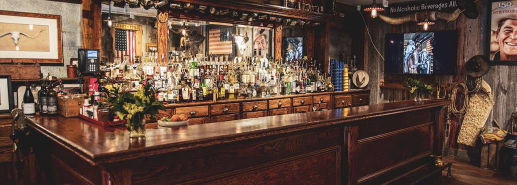 A private bar with wooden counter and cozy design, perfect for Aspen bachelorette party