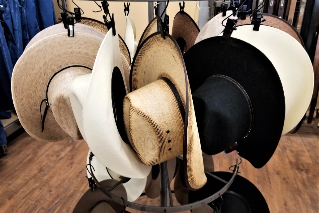A collection of stylish hats arranged in a store display at Aspen Hats, known as the best hat store.