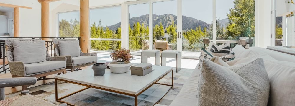 Inside the luxury Aspen vacation homes with aesthetic interior design and overlooking view of mountain