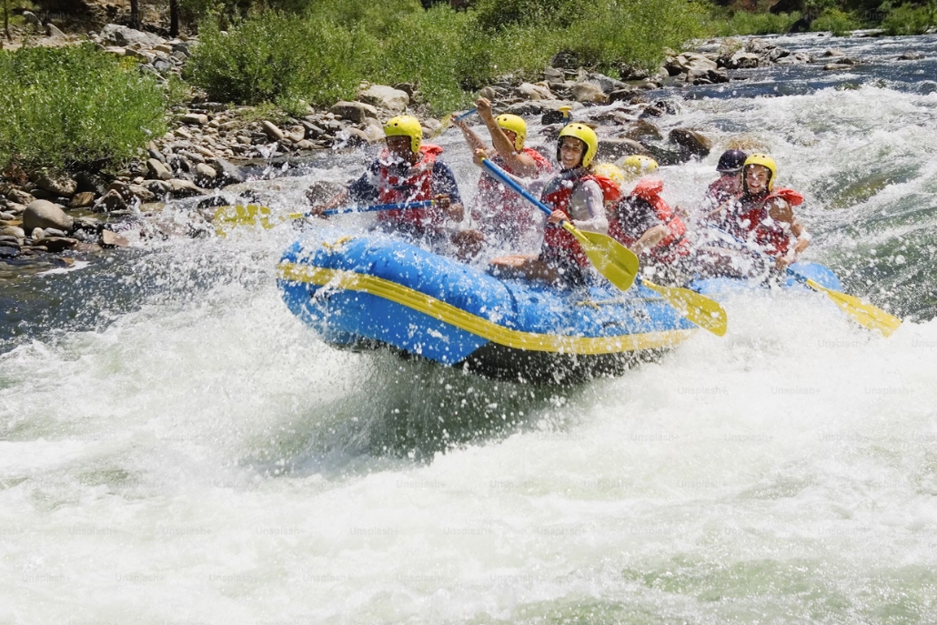 A lively rafting group tackles the swift currents of the Roaring Fork River in Aspen, capturing the excitement of summer.