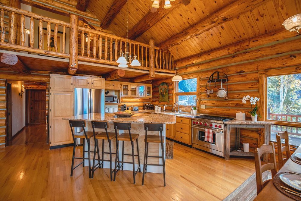 Warm and inviting kitchen inside a log cabin in Aspen in July