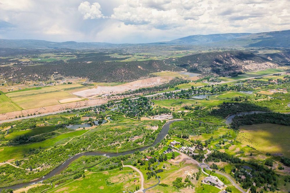 Expansive aerial view of Aspen's lush landscapes