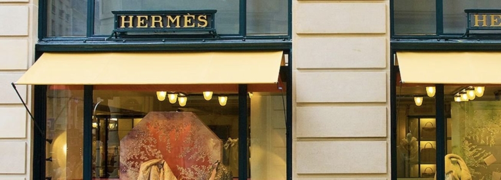 A luxurious Hermes Paris store showcasing elegant displays and high-end fashion items.