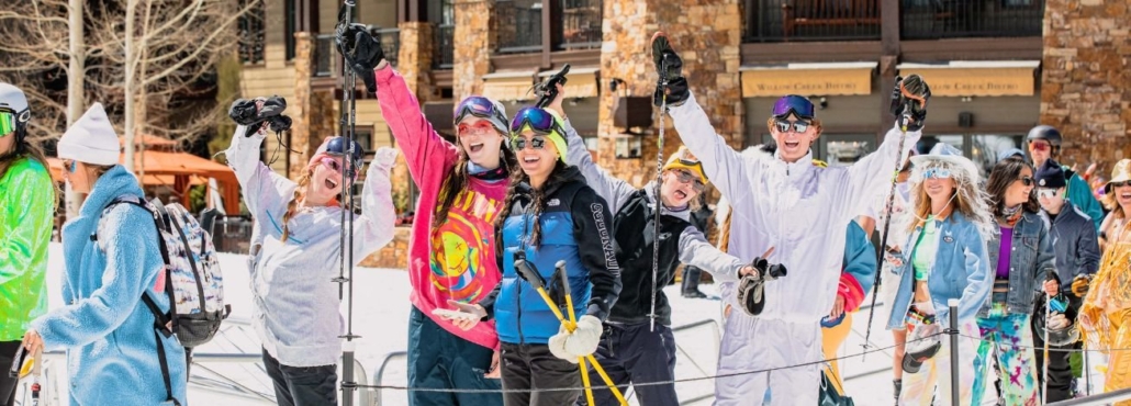 Tourists in Aspen are skiing, in the midst of the winter season