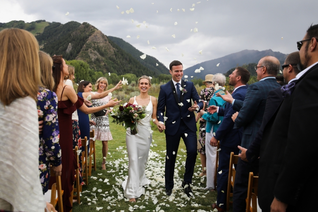 Colorado wedding photographer captures an intimate elopement at Aspen Meadows Resort, highlighting the serene mountain backdrop.