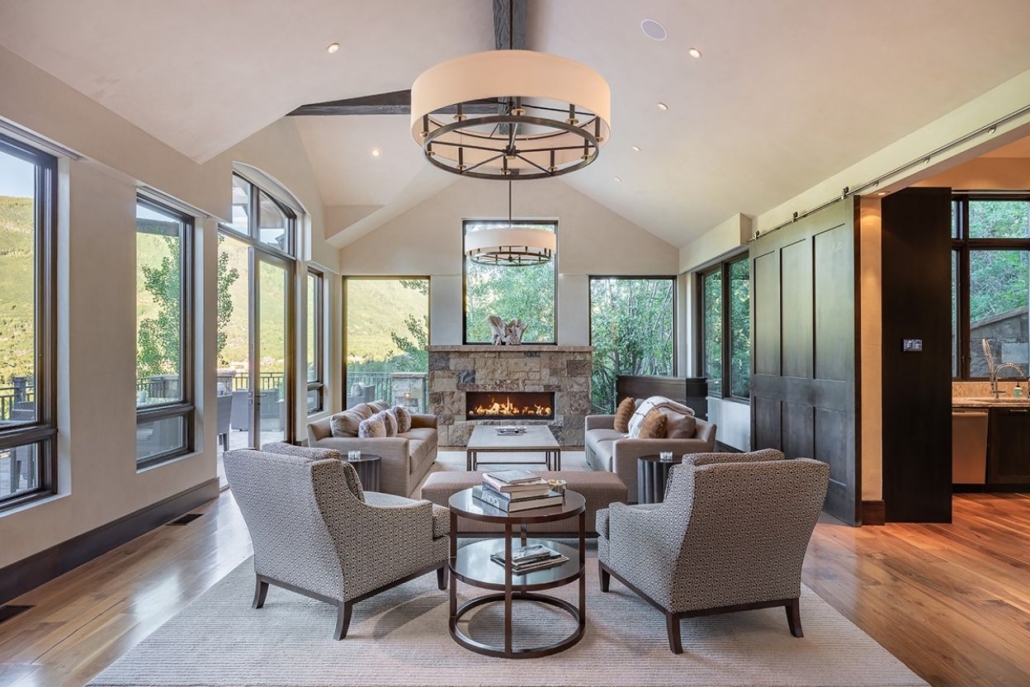 Elegant living room with a modern and stylish interior design, showcasing the warmth of Aspen Core Chalet in February.