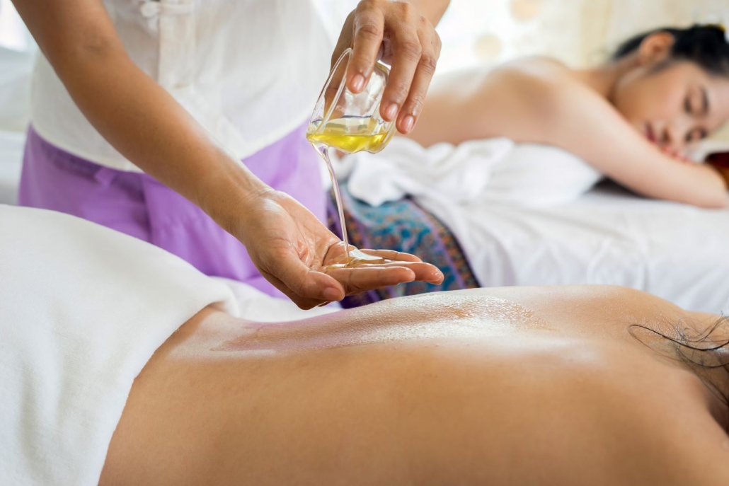 A woman receives a calming oil massage in a spa, enhancing her relaxation and well-being on Aspen in January