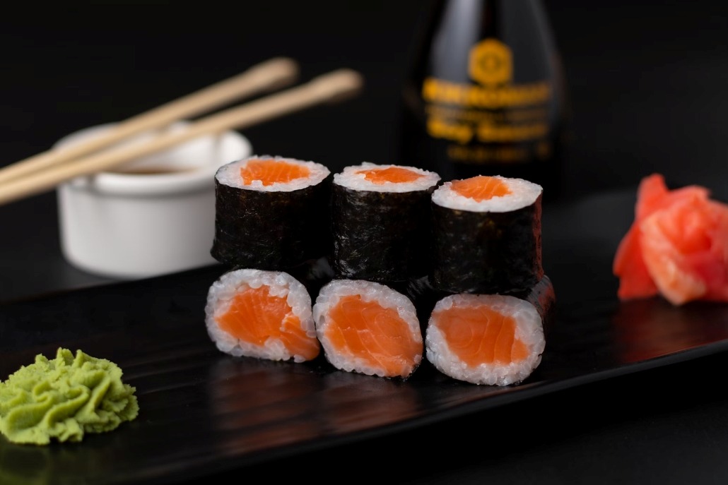 Sushi rolls with salmon and wasabi served on a black plate at Matsuhisa Aspen in February.
