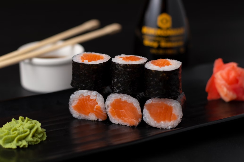 Sushi rolls with salmon and wasabi served on a black plate at Matsuhisa Aspen in February.