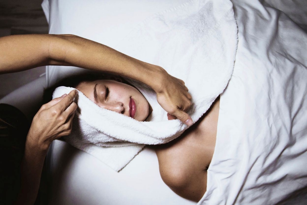 A woman receiving a relaxing back massage during a luxurious spa day for an Aspen bachelorette celebration.