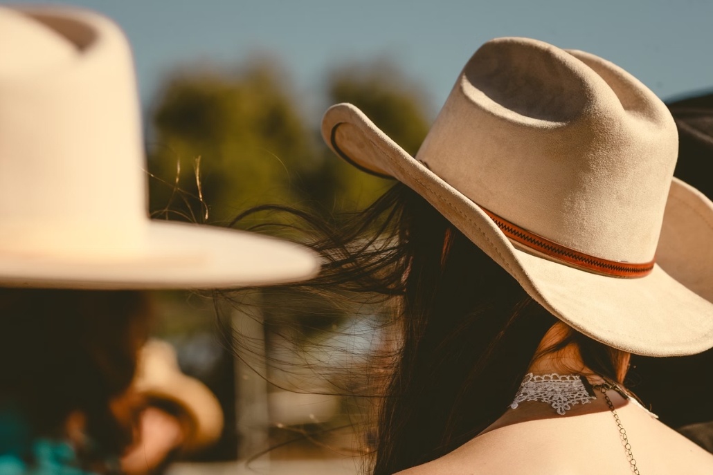 A individual wearing cowboy hats, highlighting the Aspen Style from Aspen Hats.