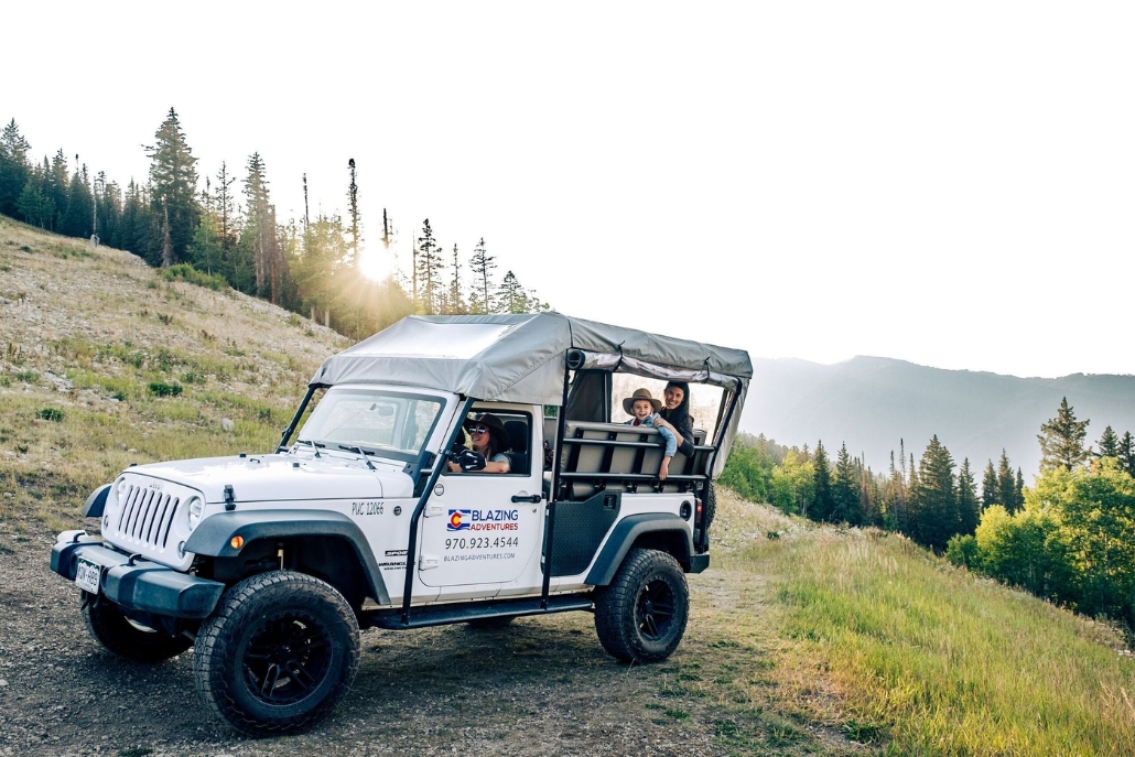 A jeep navigates a mountain road during a private summer tour in Aspen.