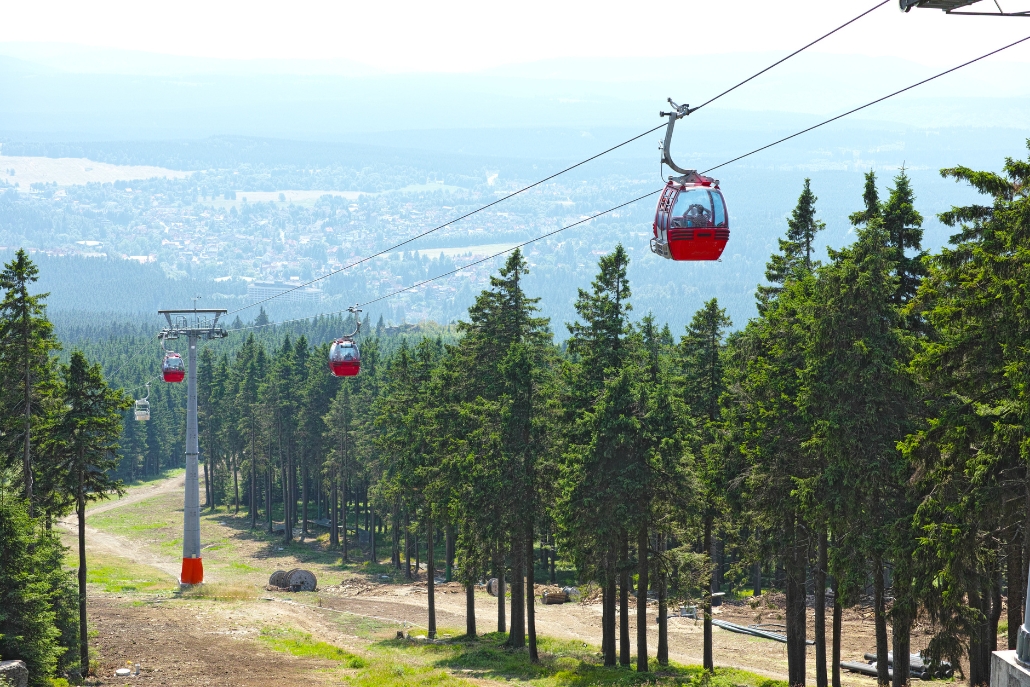 The Silver Queen Gondola ski lift features a red cable, offering scenic views in Aspen during the summer.