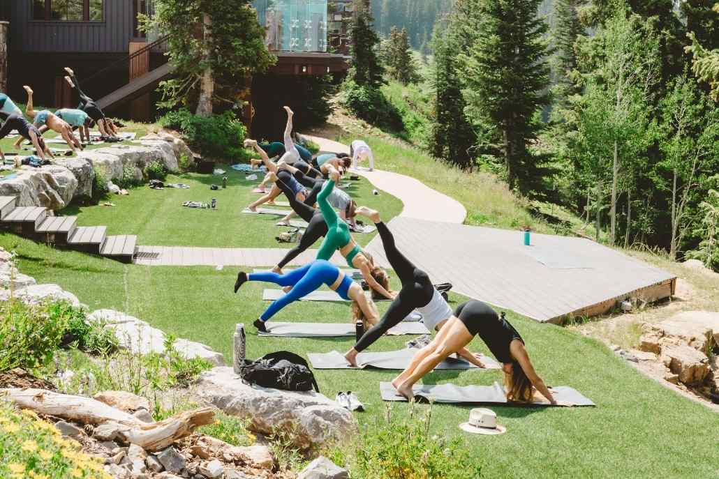 Tranquil mountain yoga retreats in Aspen, highlighting summer wellness activities amidst stunning natural scenery.