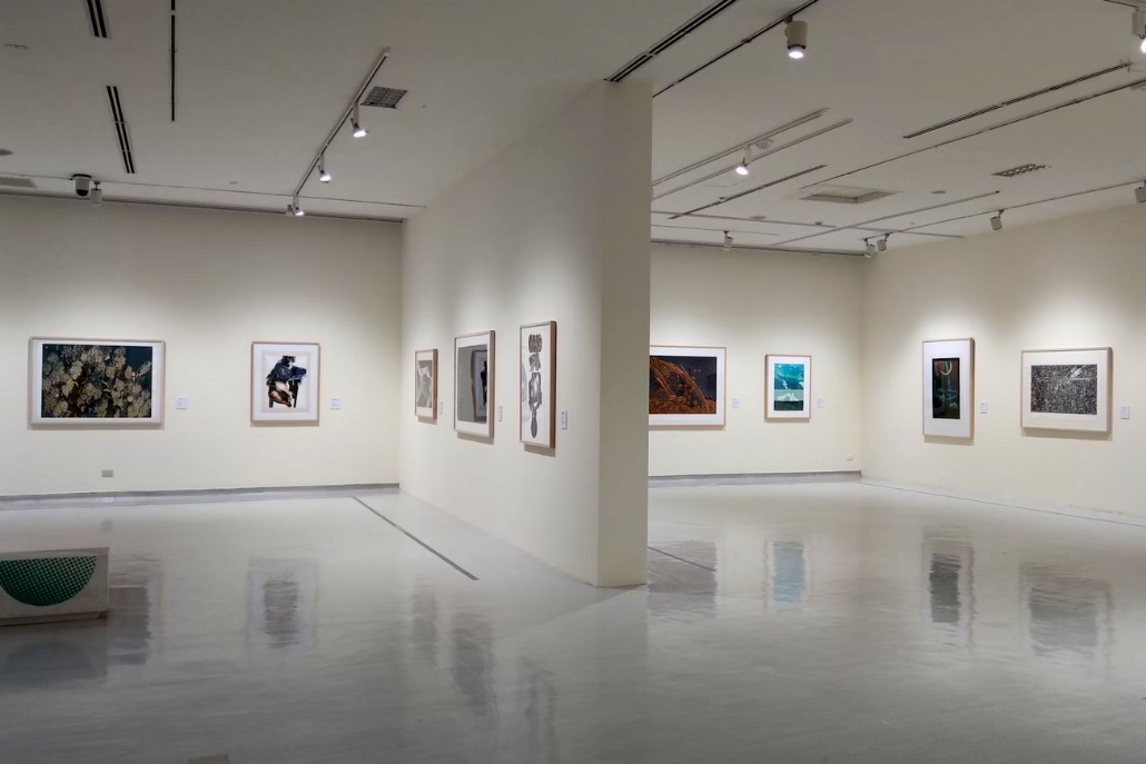 Interior of an art gallery with multiple framed artworks on the walls, highlighting the Aspen Art Museum's collection.