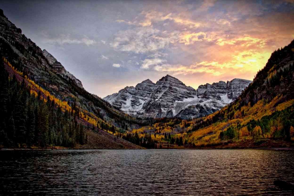 Majestic Maroon Bells surrounded by colorful autumn trees in Aspen, Colorado, captured in October.