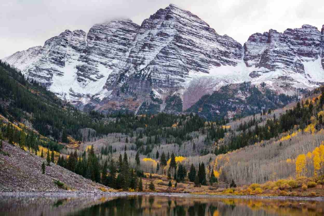 September in Aspen with golden aspen trees along a mountain trail, ideal for hiking.