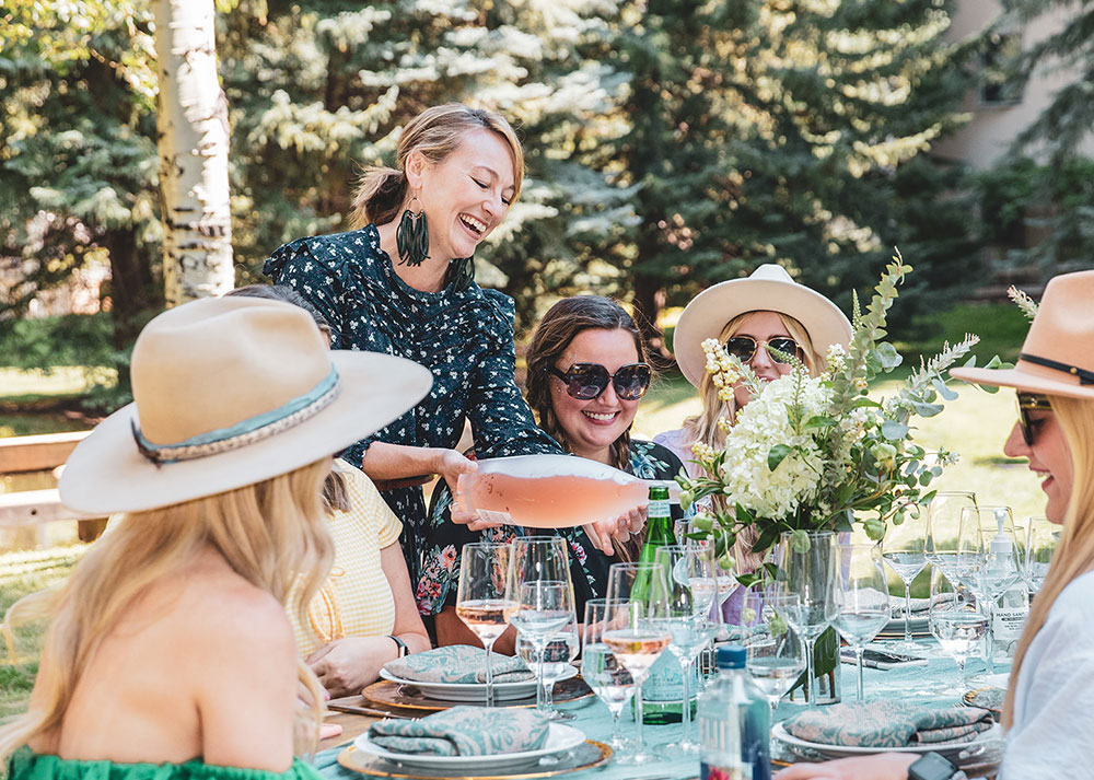 team of professionals having corporate retreat wine experience in Aspen