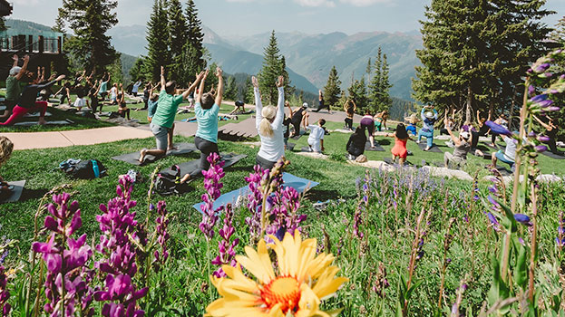 Summer corporate retreat doing yoga in Aspen