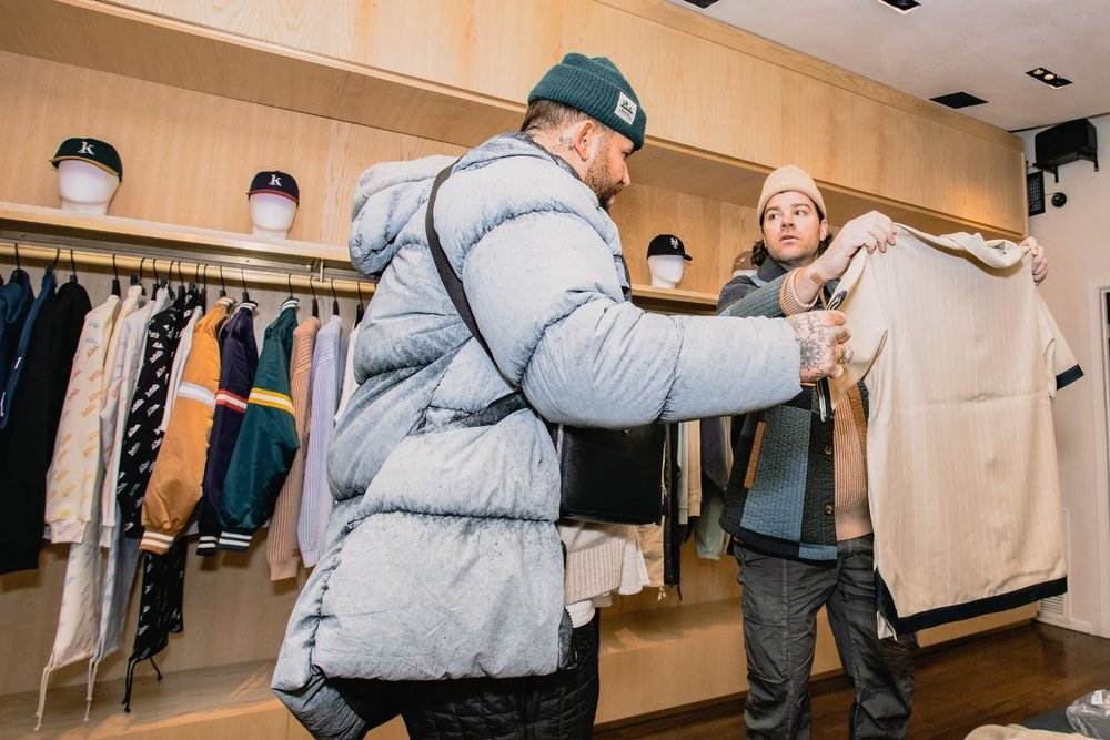 Luxury shopping experience in Aspen Colorado with customers browsing high-end clothing in a boutique store