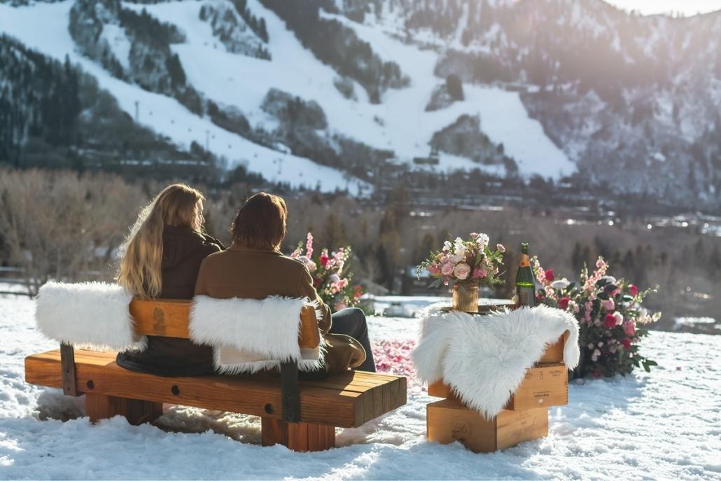 Romantic Aspen mountain picnic setup for couples with luxury winter views and champagne