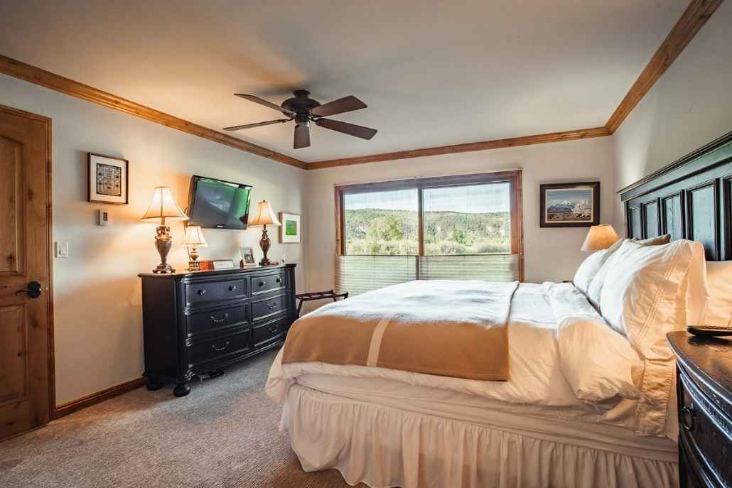Luxury Aspen vacation rental bedroom with scenic mountain views and premium accommodations