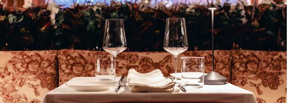 Elegant private dining table at a luxury Aspen restaurant prepared for an exclusive dinner experience
